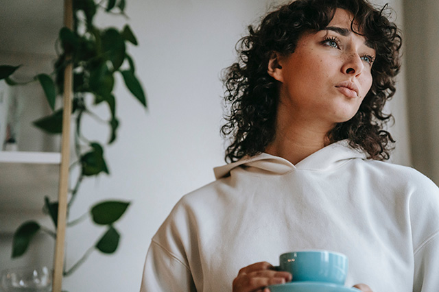 woman thinking about which kind of tv aerial to buy